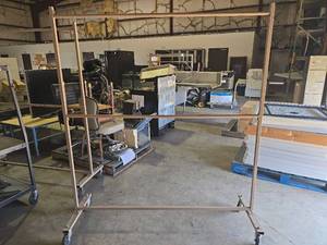 lot 47172 image: Rolling Garment Rack with Casters