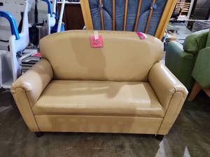 lot 47340 image: Childrens Tan Vinyl Loveseat with Wood Feet