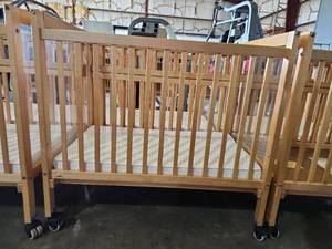 lot 47462 image: Evacuation Full-Size Crib with Mattress and Small Locking Wheels