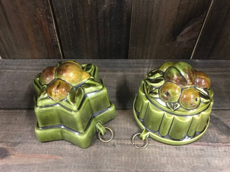 lot 140 image: Vintage Green ceramic jello molds decorated with fruit