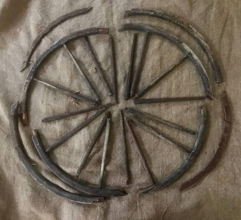lot 202 image: Rustic Wagon Wheel pieces from a cart....perfect for a reclaimed wood project
