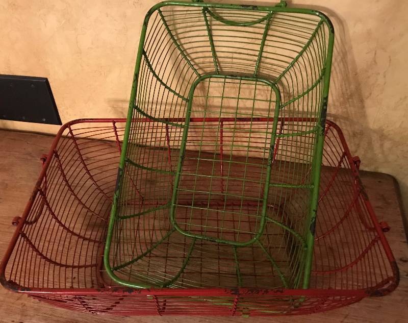 lot 223 image: Set of two distressed wire baskets (red and green)