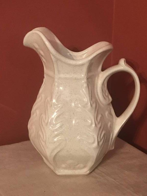 lot 284 image: 12 Cream colored ceramic Pitcher