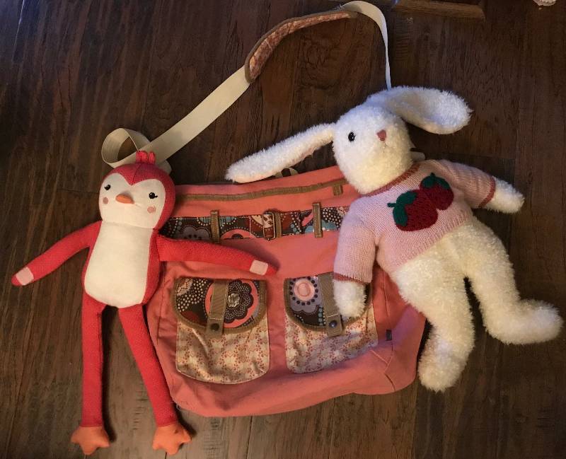 lot 286 image: Pink Tote Bag with pockets and pink stuffed penguin and white rabbit