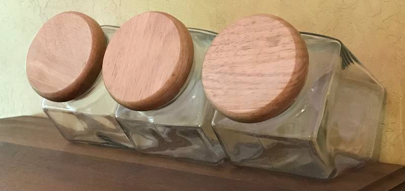 lot 1008 image: Set of 3 glass cannisters with wood lids