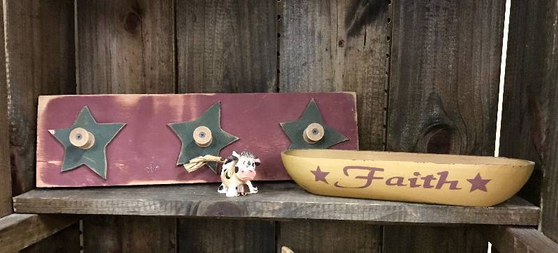 lot 1011 image: Farmhouse Dcor items (Wall Hooks made out of stars and spools, small cow figurine and wooden bowl--Faith)