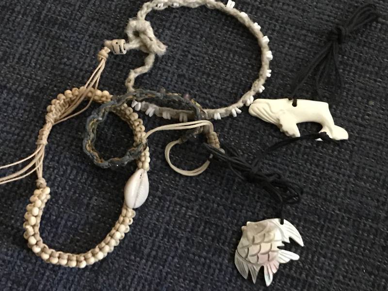 lot 1055 image: Necklaces (humpback whale out of whale bone and fish) along with bracelets