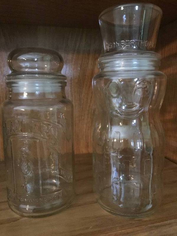 lot 26 image: 2 Glass Planter Peanuts collector Jars--one jar commemorates 75th Birthday