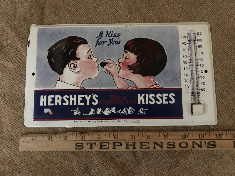 lot 29 image: Vintage Hershey Kisses Tin with thermometer