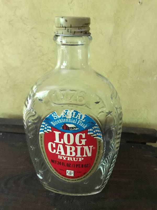 lot 38 image: Collectible Log Cabin Syrup Bottle Kitchen Dcor