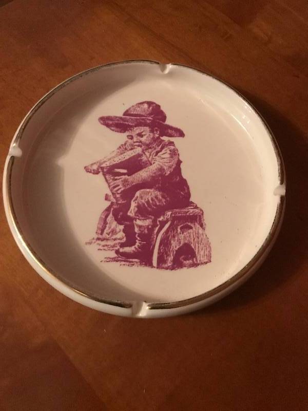 lot 42 image: Vintage ash tray with farmboy scene