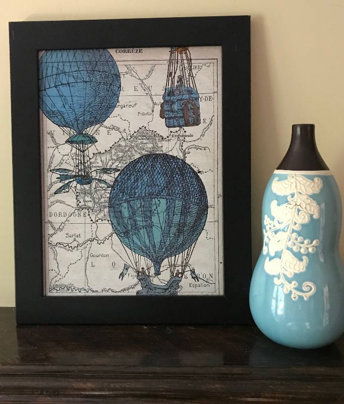 lot 162 image: Black Framed Map with Hot Air Balloons (15 x 17)  and Aqua colored 12 12 Vase