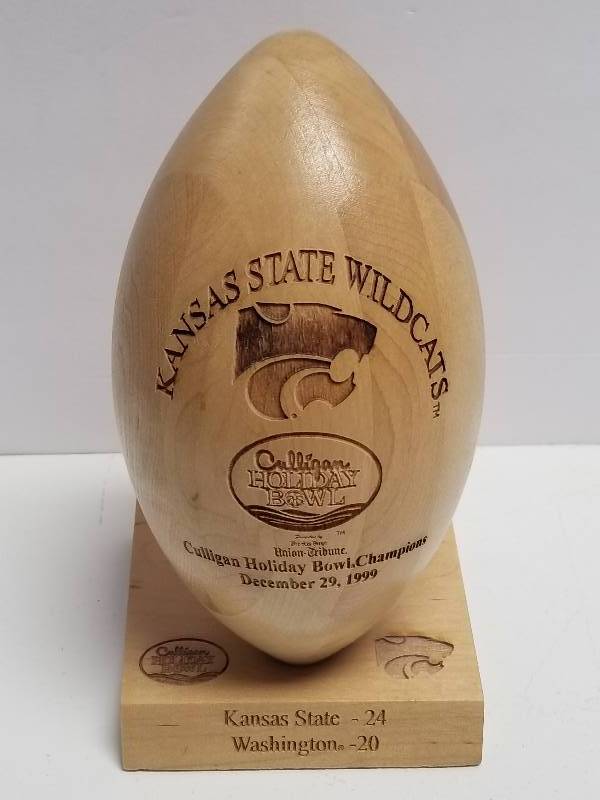 lot 1225 image: 1999 Kansas State Wildcats Holiday Bowl Champions Engraved Wooden Carved Football Display Limited