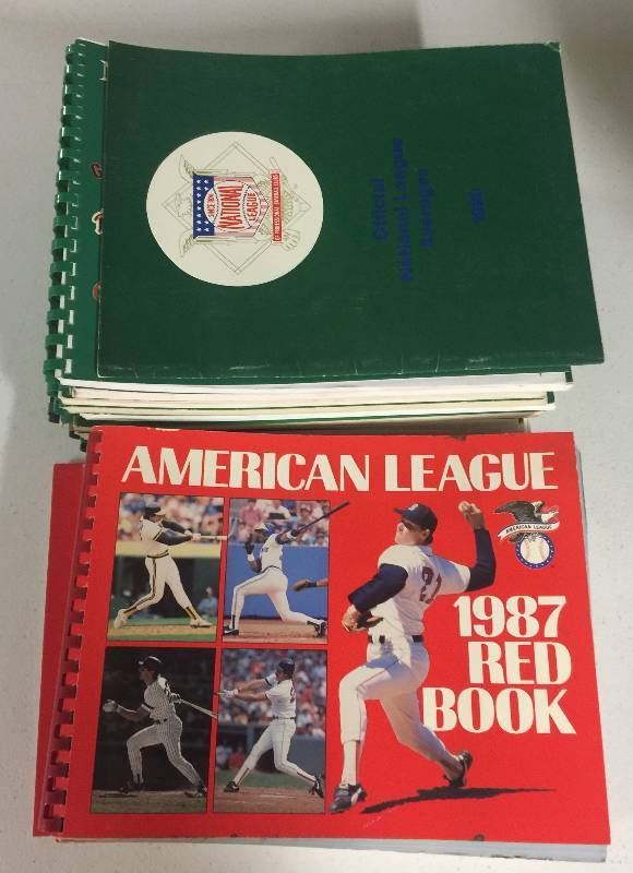 lot 1060 image: 17 Major League Baseball Red & Green Books Official Media Guides in Mint Conditions