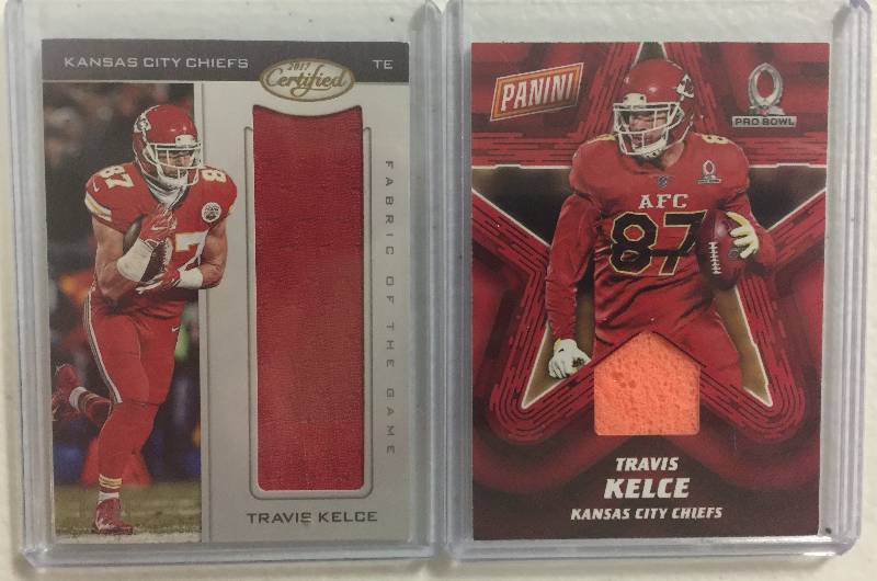 lot 1260 image: Two Travis Kelce Player Worn Rookie Kansas City Chiefs Game Used Swatches Football Cards