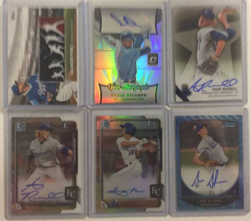 lot 1276 image: Six Kansas City Royals Autographs & Game Used Jersey Pieces - Rookies & Numbered Cards - Salvador Perez, Paulo Orlando, Moon, Russell Less than $2.00 a Card