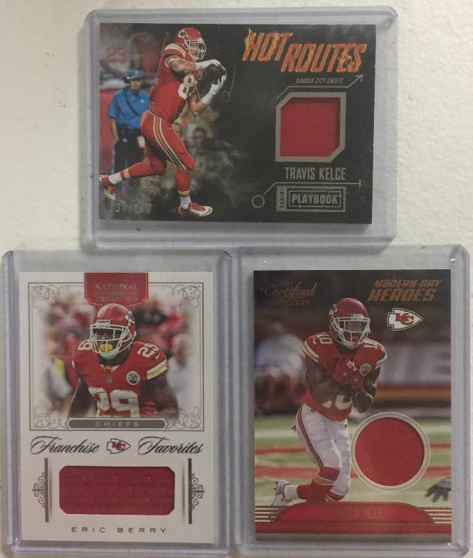 lot 1281 image: Three Kansas City Chiefs Player Worn Jersey Relic Football Cards - Travis Kelce, Eric Berry, & Tyreek Hill