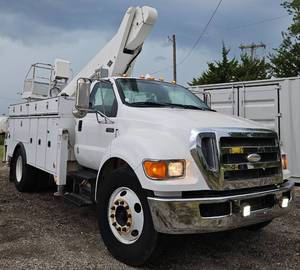 lot 25 image: 2008 Ford F-650 Non-CDL 60ft Working Height Versalift LT-60 Bucket Truck, Booms Controls Work from Basket & Turret, All Bed Doors Lock, Bins in Back are 10, 8, 6 in Depth, Great Running Truck, No Issues, 169k Miles