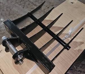 lot 397 image: Unused Mini Excavator Rake Attachment