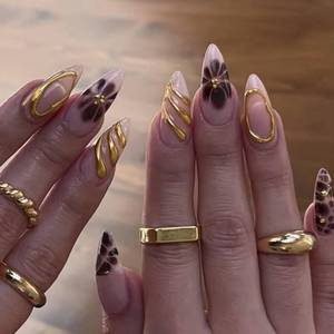 lot 16089 image: 5D Embossed Gold Stripe Press on Nails Medium Almond Fake Nails with Black Flower Design Reusable Glossy Gold Rhinestone False Nails for Women Girls Daily Manicure 24pcs