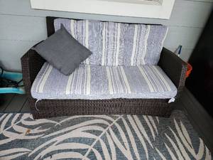 lot 906 image: Phi Villa outdoor loveseat with cushions