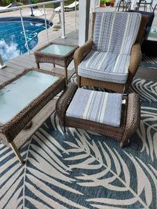 lot 907 image: Martha Stewart Collection patio set includes glider swival chair with cushions, footstool, side table and coffee table (needs repaired)