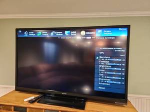 lot 1006 image: Sharp Aquos 60 in LDC TV works with remote, located in basement