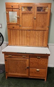 lot 1011 image: Vintage Hoosier cabinet with icebox and flour storage with pull out metal shelf 72 x 44 x 26, located in basement