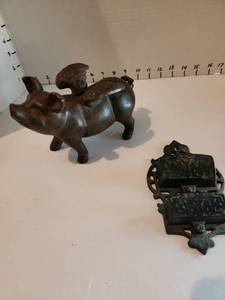 lot 1046 image: Cast iron flying pig and match sticks