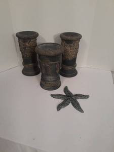 lot 1109 image: Decorative Pillar Candle Holders with Starfish. Tallest is 10 inches