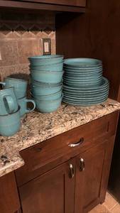 lot 1207 image: Turquoise Ceramic Dinnerware Set with brown Trim - 8 dinner plates, 9 small plates, 7 bowls (one has small chip) and 8 cups