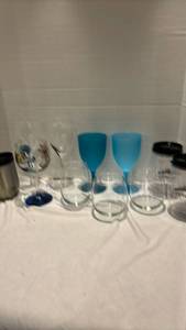 lot 1229 image: Two plastic blue and three glass stem glasses, and other glasses