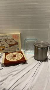 lot 1243 image: Bissell Warming Trivette, small glass pan and one stainless steel canister with clamp lid