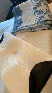 lot 1419 image: Memory foam pillows and throw blanket that needs repair