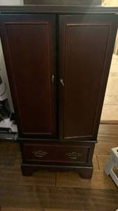 lot 1518 image: Dark Wood Armoire Cabinet with Two Drawers 38 x 18 x 15 in