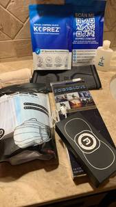 lot 1572 image: Nooro Smart Massage Device with Blue LED Indicator, Knee brace, masks, socks,l and more