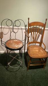 lot 2002 image: Antique vintage metal and wood ice cream parlor chair and wooden Antique rocking chair wood and floral needlepoint cushions chair with cane seat IN BASEMENT