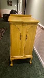 lot 2009 image: Vintage yellow cabinet on wheels IN BASEMENT