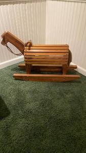 lot 2011 image: Wooden rocking horse IN BASEMENT