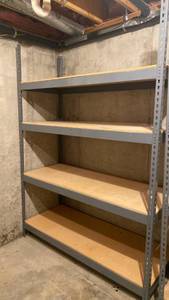 lot 2101 image: Heavy-duty metal storage rack with 4 particle board shelves IN BASEMENT