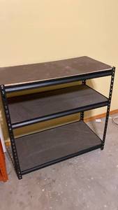 lot 2203 image: Black metal and particle board shelf IN BASEMENT