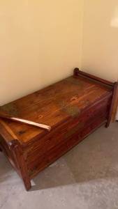 lot 2211 image: Cedar chest with metal trim, one handle broken off IN BASEMENT