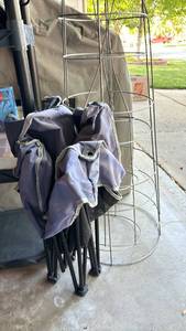 lot 3008 image: Two Large Tomato cages and 1 smaller one, plus folding chair