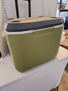 lot 3222 image: Coleman rolling cooler with cup holders on lid