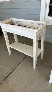 lot 4001 image: White plastic planter - 36 inches tall, 36 inches long and 15.5 inches wide