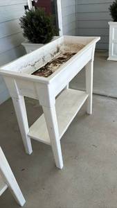 lot 4002 image: White plastic planter - 36 inches tall, 36 inches long and 15.5 inches wide
