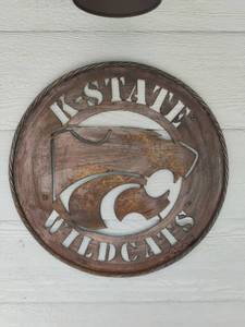 lot 4102 image: Metal Kansas State Wall Art Sign. 25 inches diameter   Some paint is chipping