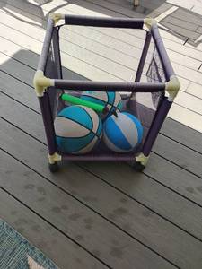 lot 4116 image: Toys.  Basketballs inside Hamper.  Hamper is 21 x 18 x 18