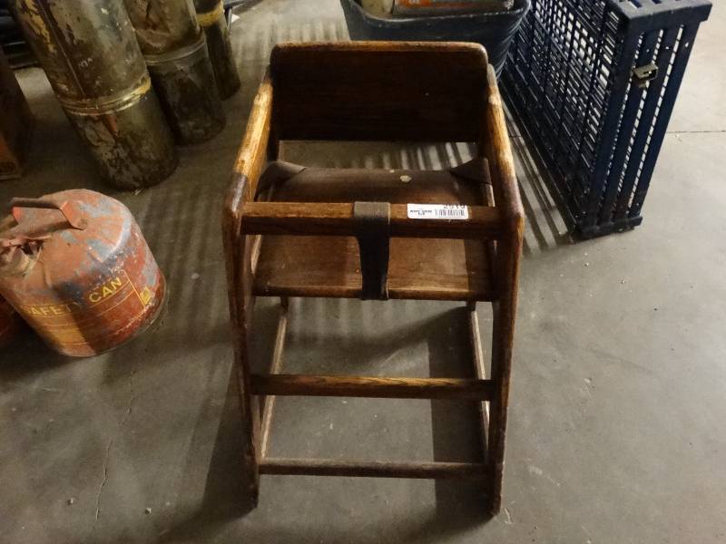 lot 2519 image: Dark colored high chair.