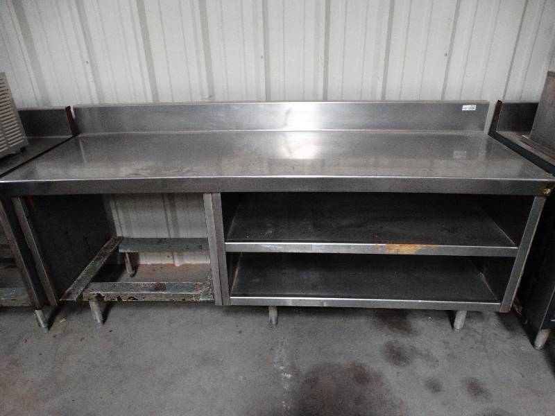 lot 2551 image: 7W x 28D Stainless steel table with shelves and backsplash. Pins on the left and holes to the right side for connecting other tables.